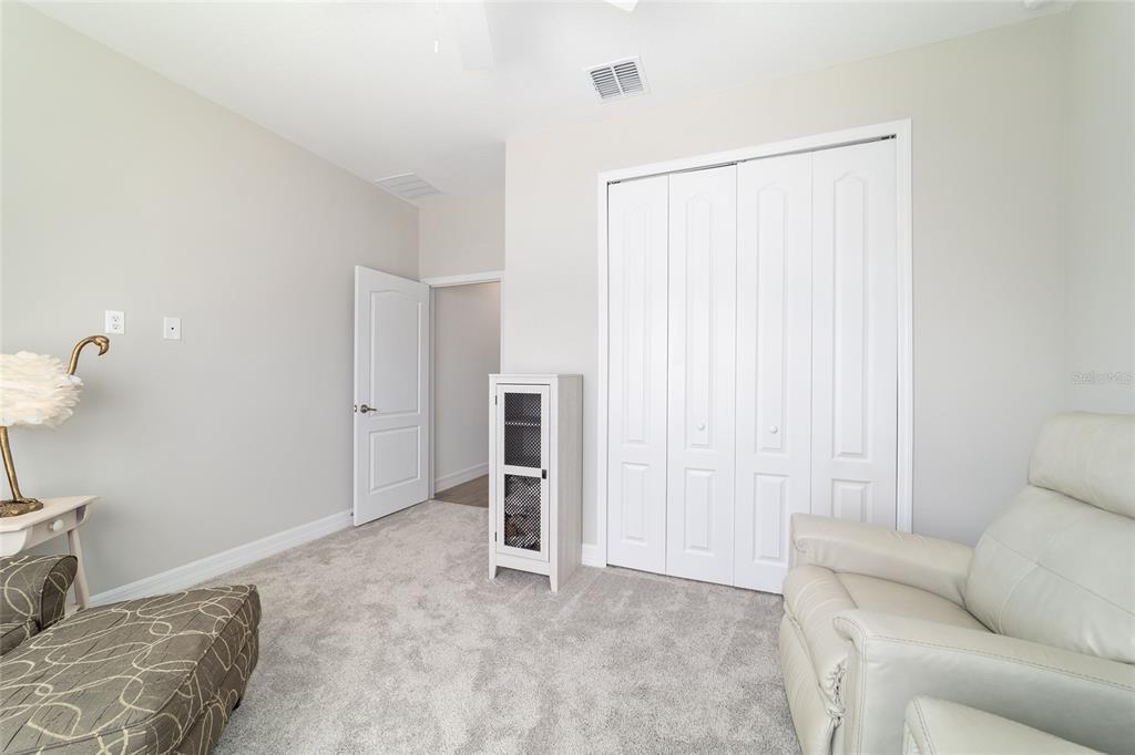 4838 Southwest 130th Street Ocala, FL 34473 - Photo 27 of 48 a living room with furniture and a ceiling fan