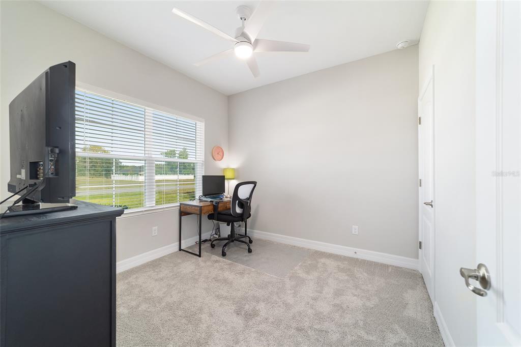 4838 Southwest 130th Street Ocala, FL 34473 - Photo 31 of 48 a view of workspace with furniture and a window