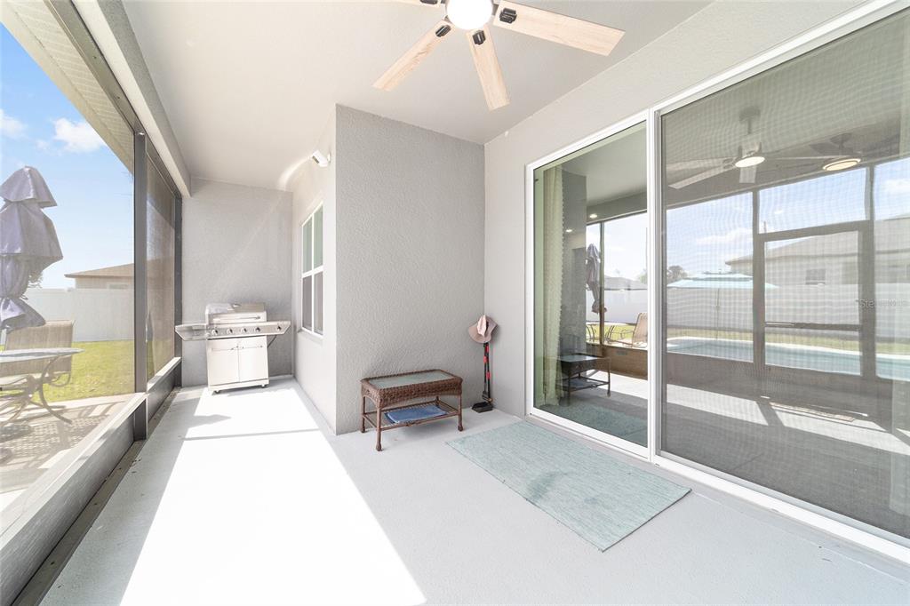 4838 Southwest 130th Street Ocala, FL 34473 - Photo 36 of 48 a large white room with a large window and furniture