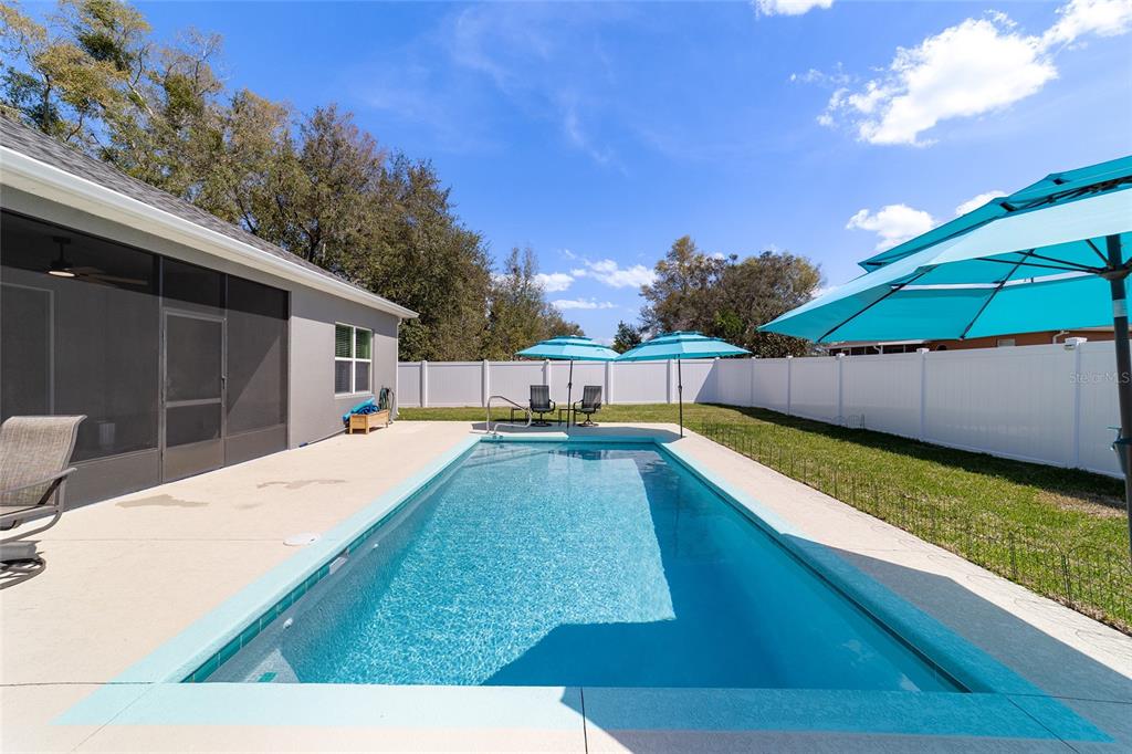 4838 Southwest 130th Street Ocala, FL 34473 - Photo 38 of 48 a view of a backyard with swimming pool