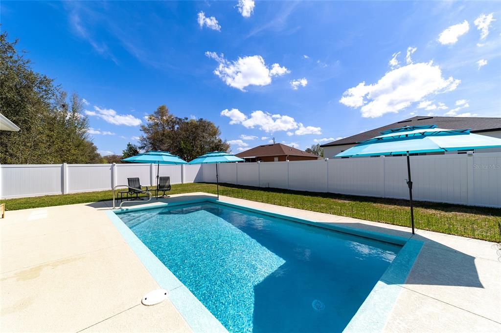 4838 Southwest 130th Street Ocala, FL 34473 - Photo 4 of 48 a view of an outdoor space and swimming pool
