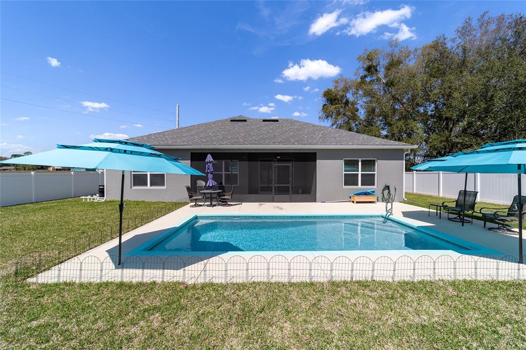 4838 Southwest 130th Street Ocala, FL 34473 - Photo 41 of 48 a view of a house with swimming pool and sitting area