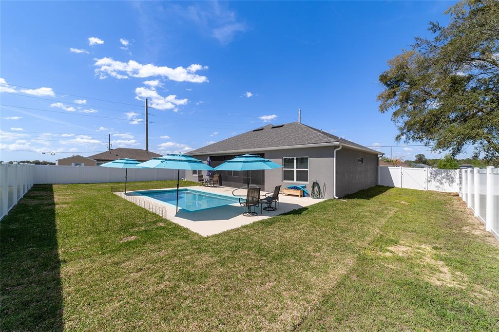 4838 Southwest 130th Street Ocala, FL 34473 - Photo 42 of 48 a view of a house with swimming pool and sitting area