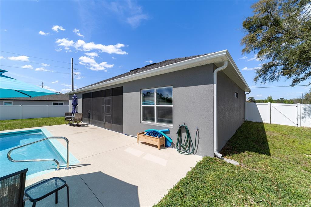 4838 Southwest 130th Street Ocala, FL 34473 - Photo 44 of 48 a view of a house with backyard and sitting area