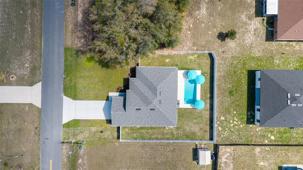 4838 Southwest 130th Street Ocala, FL 34473 - Photo 46 of 48 an aerial view of a house with a yard