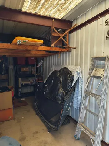 a bedroom with a bed and a mirror