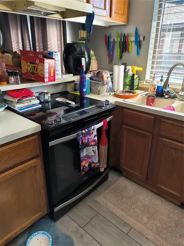 a kitchen with a stove and cabinets