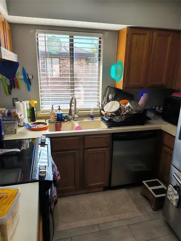 a kitchen with a sink and a stove