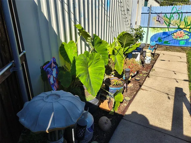 a view of a chairs and table in a balcony