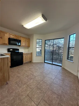 a large kitchen with cabinets