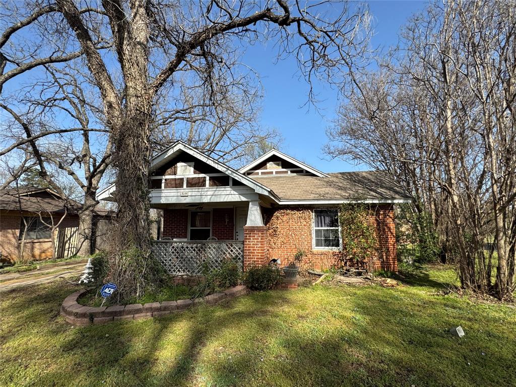 a house that has tree in front of it