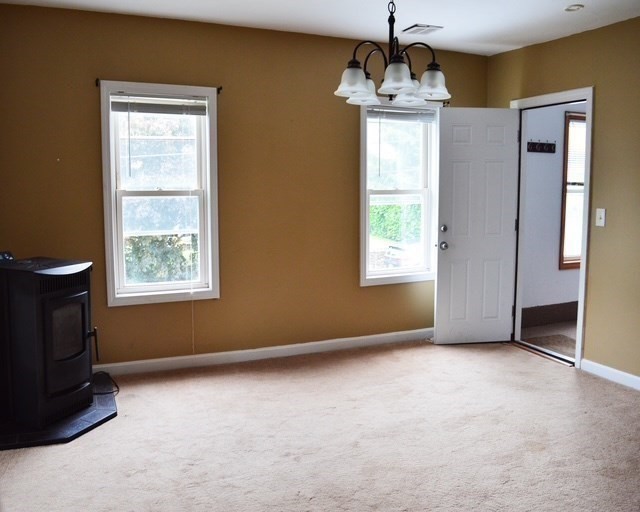 5 Anna Street Worcester, MA 01604 - Photo 10 of 19 a view of an empty room with a window and a fireplace