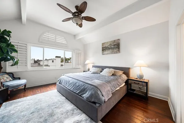 a bed room with a bed and a chair