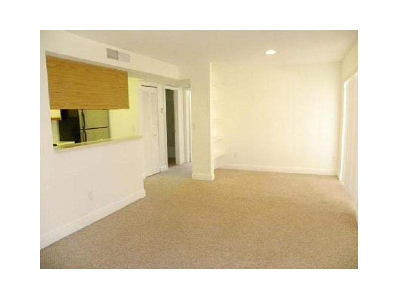 1225 Southwest 46th Avenue, Unit 204 Pompano Beach, FL 33069 - Photo 2 of 5 a view of an empty room