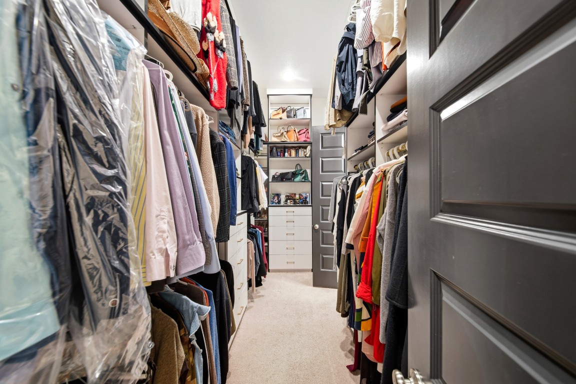 8902 Iron Forge Road Missouri City, TX 77459 - Photo 12 of 38 a view of walk in closet with clothes