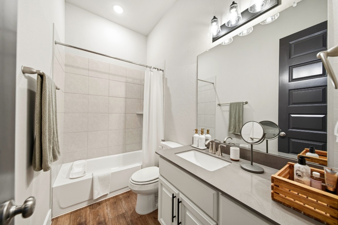 8902 Iron Forge Road Missouri City, TX 77459 - Photo 15 of 38 a bathroom with a sink a toilet and shower