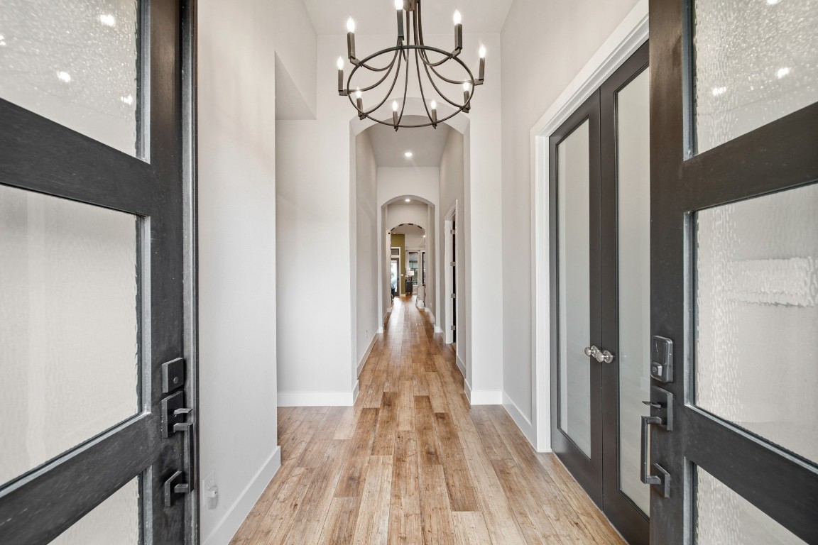8902 Iron Forge Road Missouri City, TX 77459 - Photo 2 of 38 a view of a hallway view with wooden floor and staircase