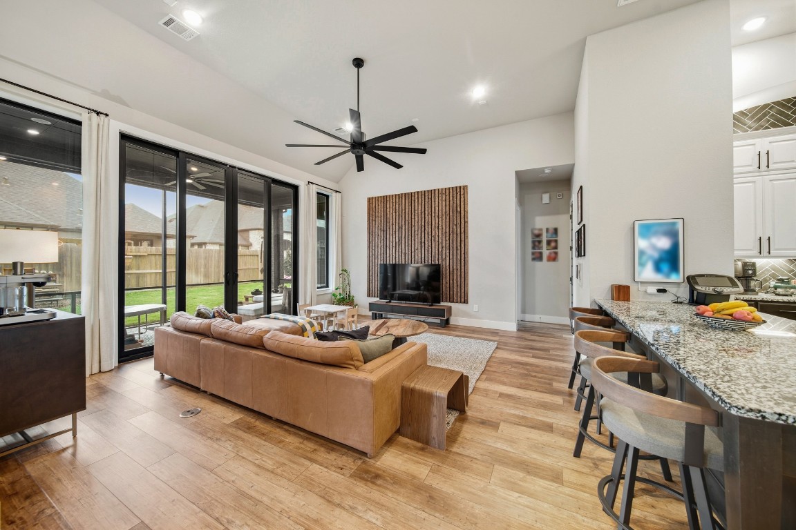 8902 Iron Forge Road Missouri City, TX 77459 - Photo 21 of 38 a living room with fireplace furniture and a large window