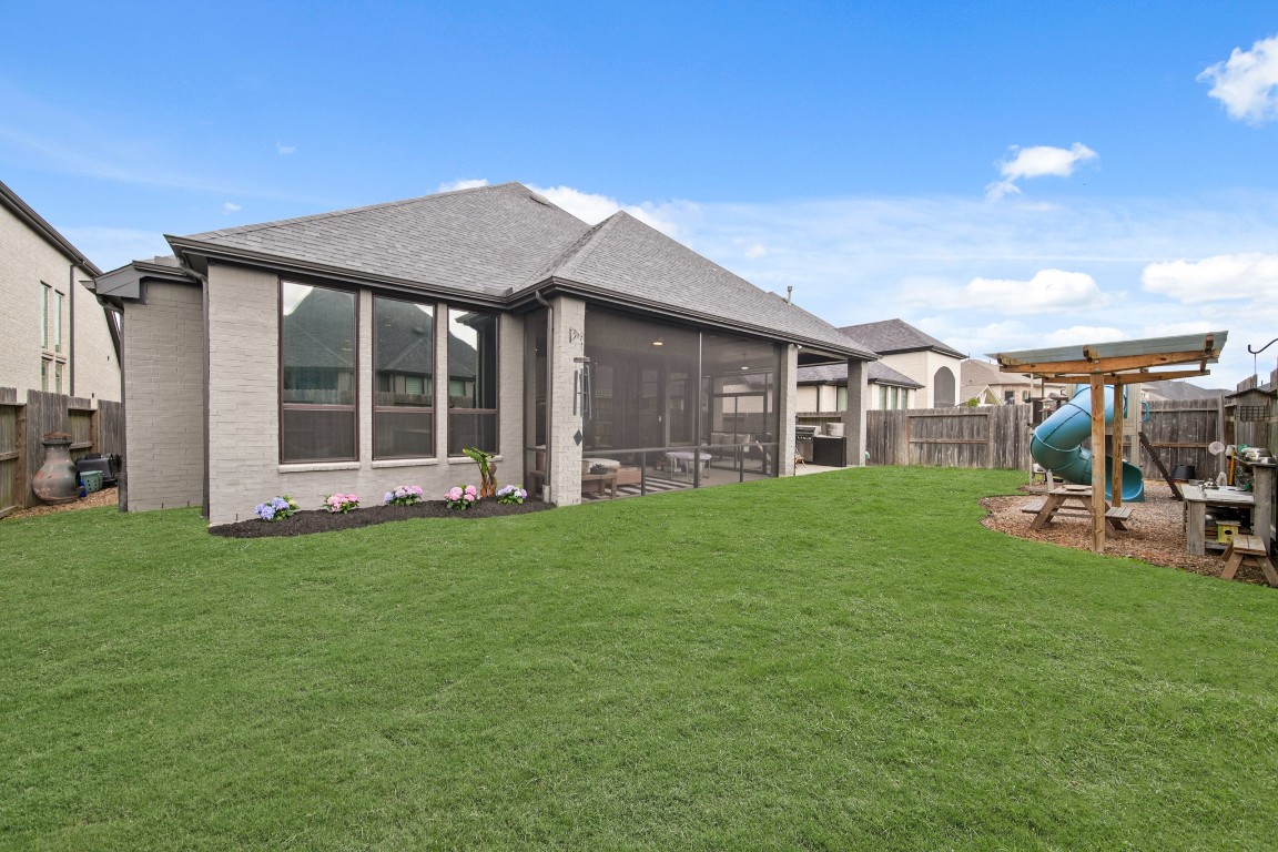 8902 Iron Forge Road Missouri City, TX 77459 - Photo 37 of 38 a view of a house with backyard porch and garden