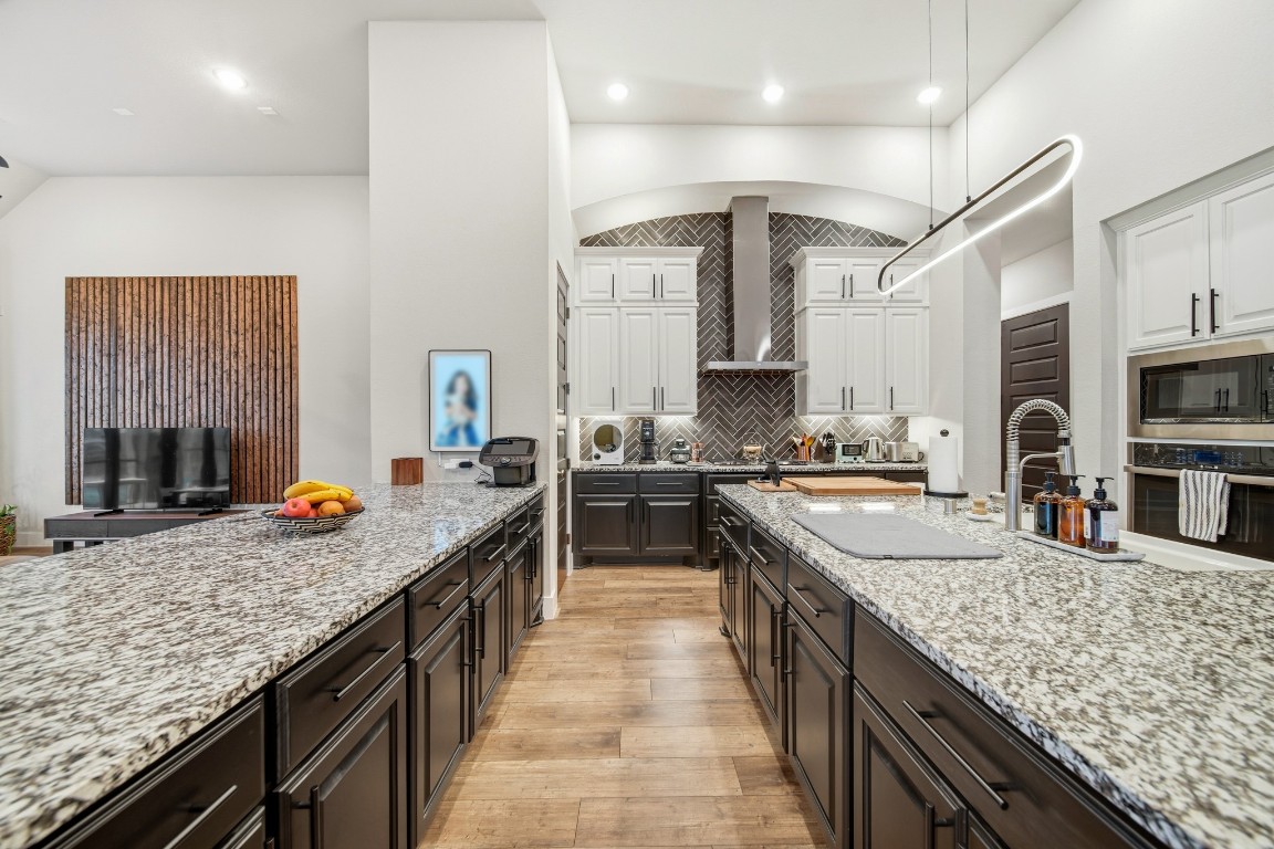 8902 Iron Forge Road Missouri City, TX 77459 - Photo 5 of 38 a kitchen with stainless steel appliances granite countertop counter space a sink and cabinets