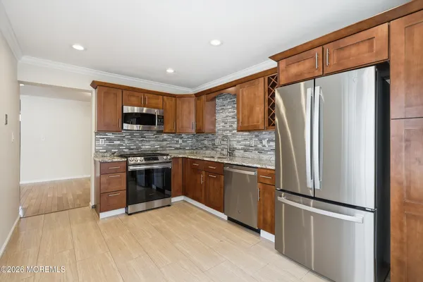 a view of an entryway with wooden floor