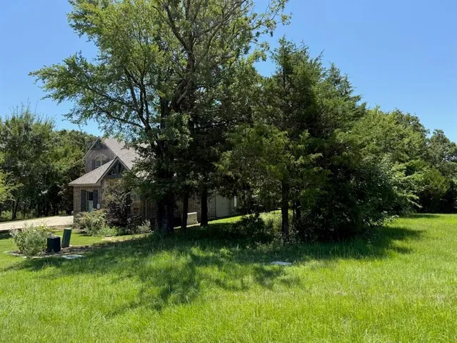 a view of a house with a yard porch and sitting area