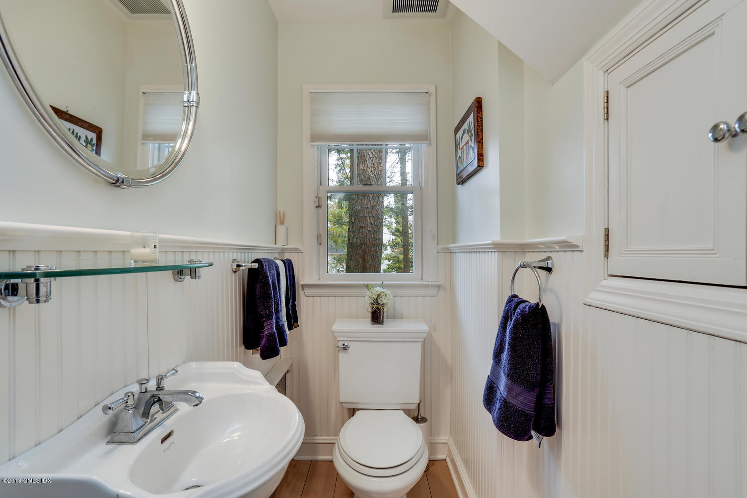 28 Indian Field Road Greenwich, CT 06830 - Photo 11 of 26 a bathroom with a sink toilet and mirror