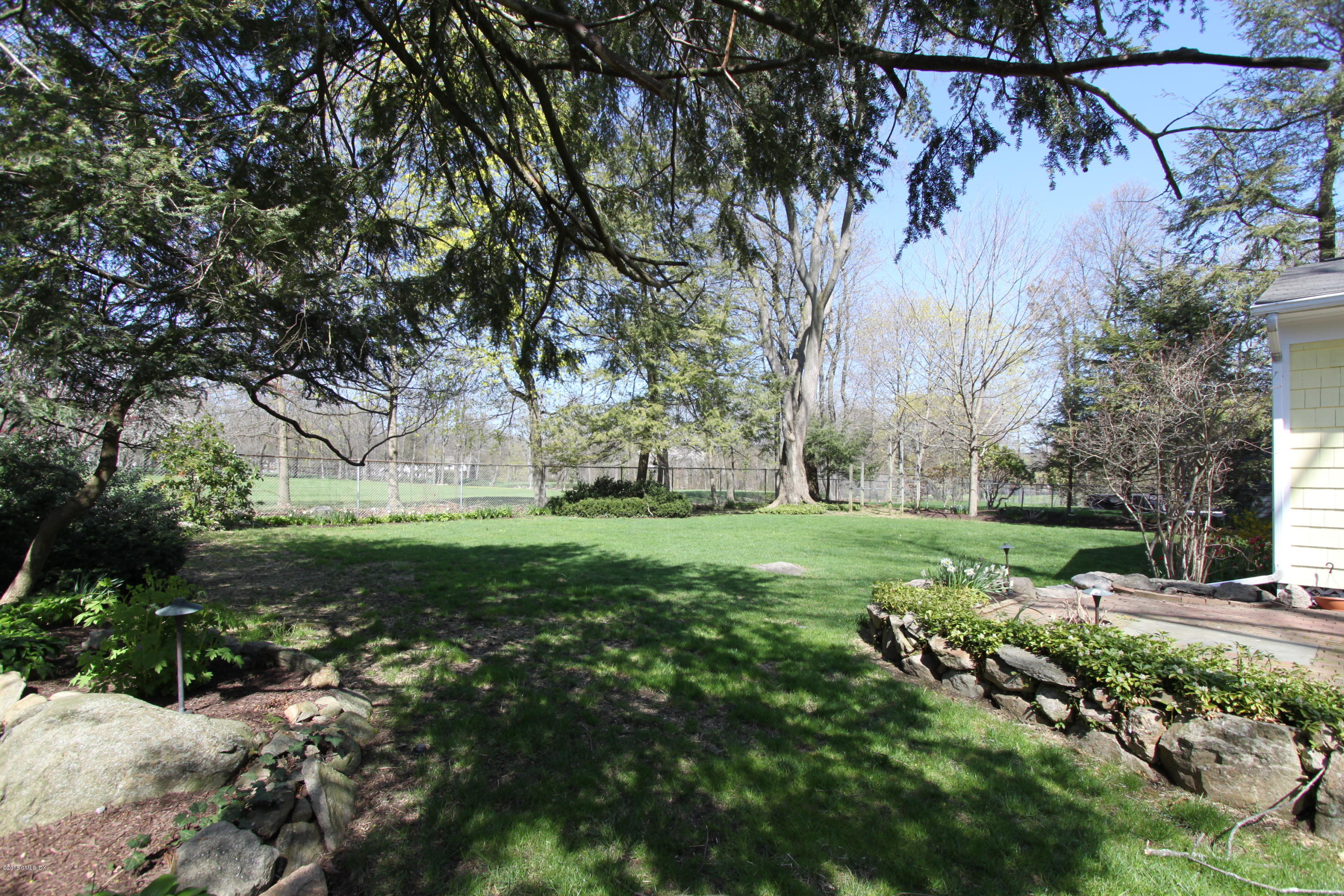 28 Indian Field Road Greenwich, CT 06830 - Photo 22 of 26 a view of a park with large trees