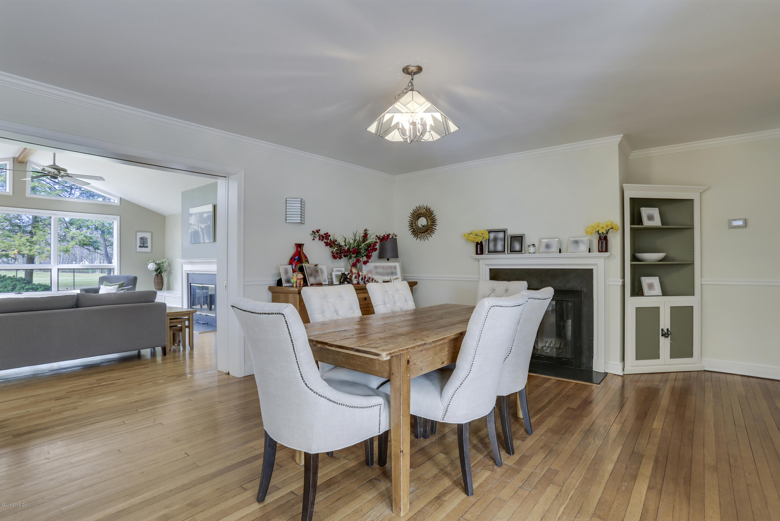 28 Indian Field Road Greenwich, CT 06830 - Photo 4 of 26 a view of a dining room with furniture window and wooden floor