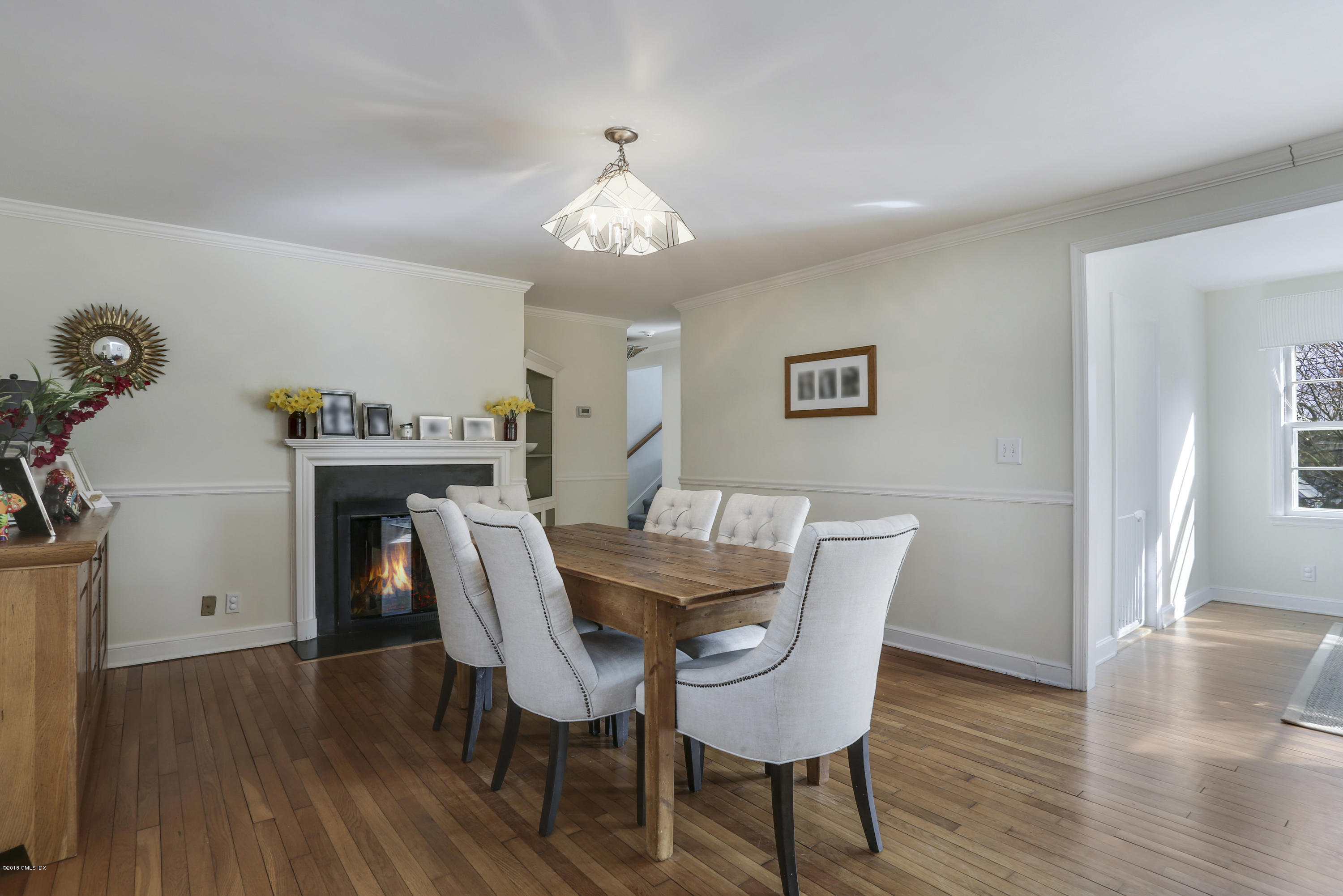 28 Indian Field Road Greenwich, CT 06830 - Photo 5 of 26 a view of a dining room with furniture wooden floor and a chandelier