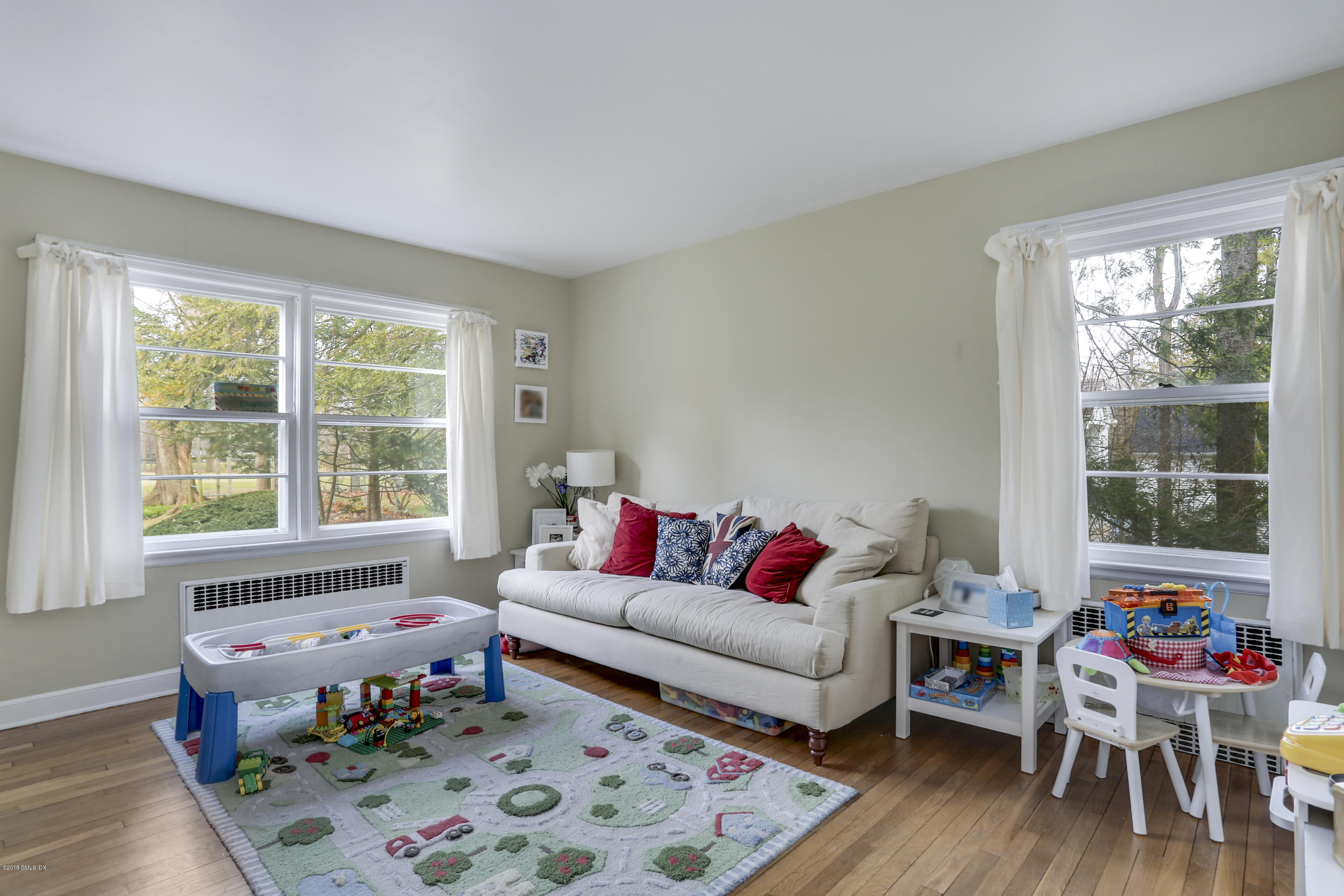 28 Indian Field Road Greenwich, CT 06830 - Photo 9 of 26 a living room with furniture and a window