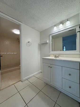 a bathroom with a double vanity sink mirror and
