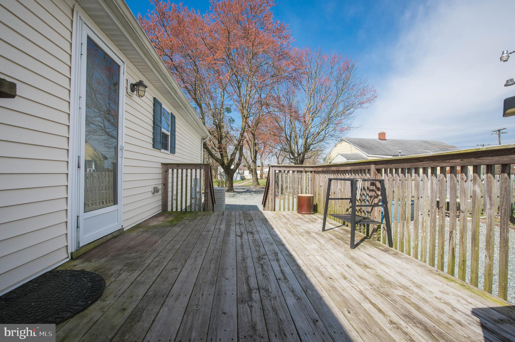 36388 Poplar Neck Road Willards, MD 21874 - Photo 12 of 34 a view of wooden balcony with a couple of trees