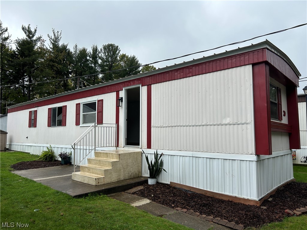 9735 Chillicothe Road, Unit 20 Willoughby, OH 44094 - Photo 1 of 16 Manufactured / mobile home featuring a front yard