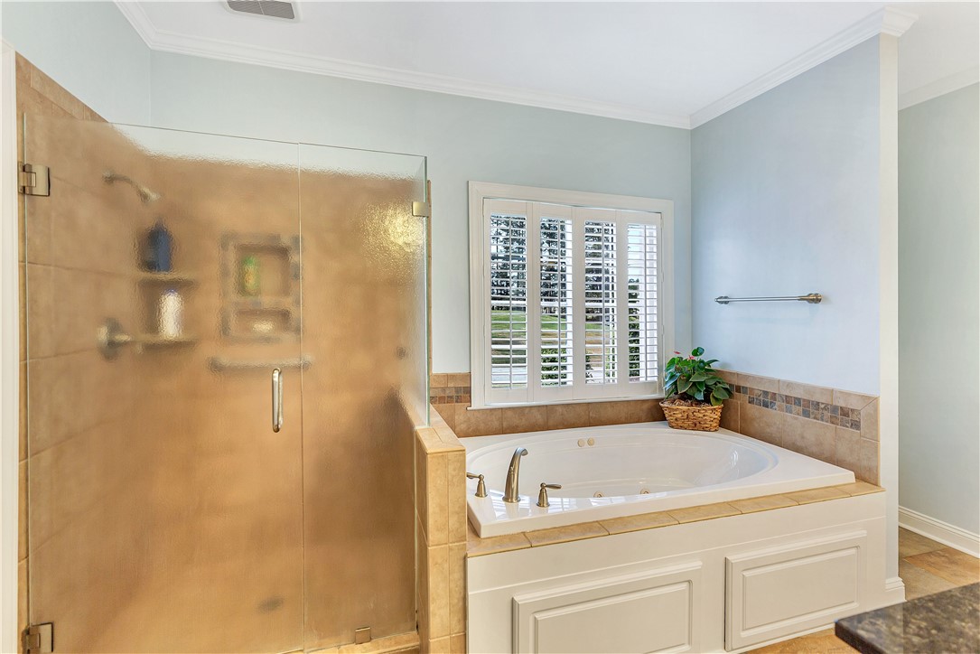 3108 Cobbs Way Anderson, SC 29621 - Photo 25 of 44 This bathroom features a deep soaking tub and a spacious shower.