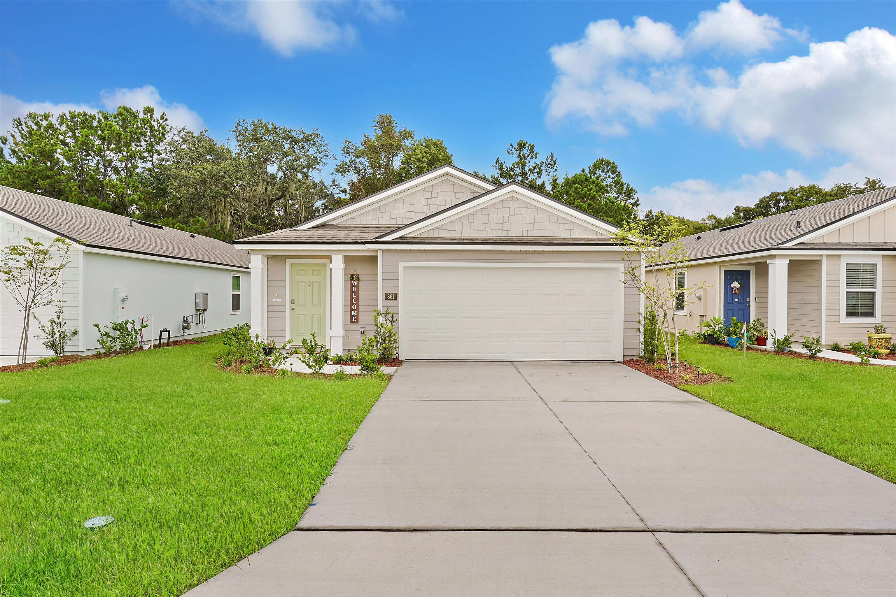a front view of a house with a yard