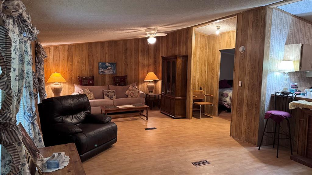 20050 Ruth Street Brooksville, FL 34601 - Photo 11 of 18 a living room with furniture a lamp and a window
