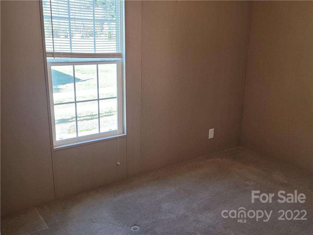 384 Stutts Road Mooresville, NC 28117 - Photo 8 of 17 an empty room with a window