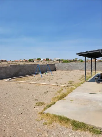 a kitchen with sink stove and cabinets
