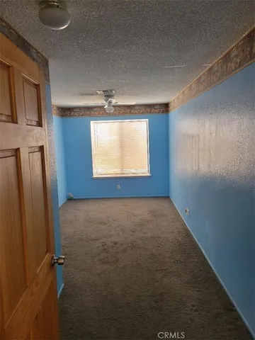 a view of a chandelier fan in a room