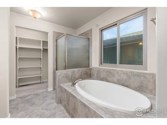 a bathroom with a bathtub and a sink