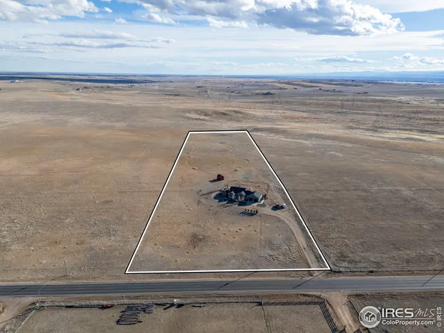 a view of a hall with wooden floor