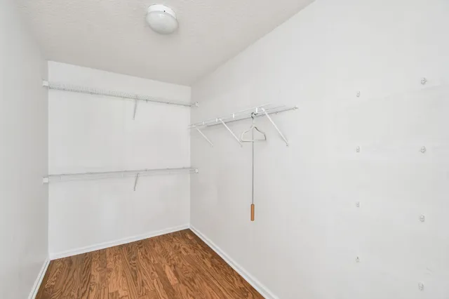 a bedroom with bed and a window