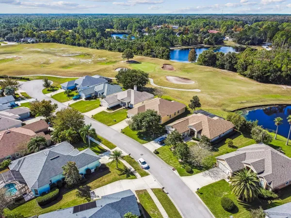 an aerial view of residential houses with swimming pool