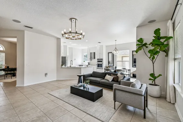 a kitchen with stainless steel appliances kitchen island granite countertop a sink and cabinets