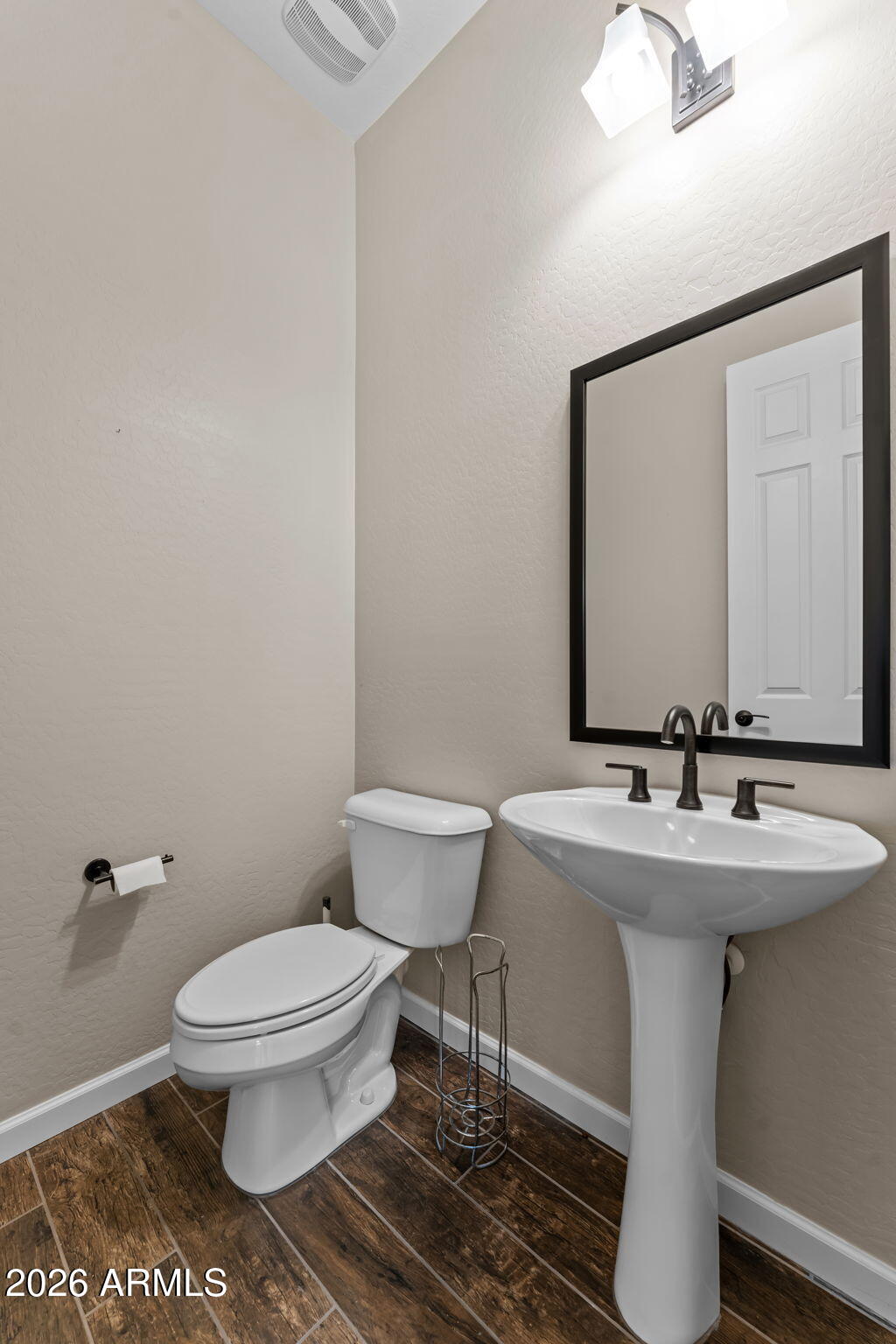 3675 Gold Ridge Road Wickenburg, AZ 85390 - Photo 29 of 58 a bathroom with a sink toilet and mirror