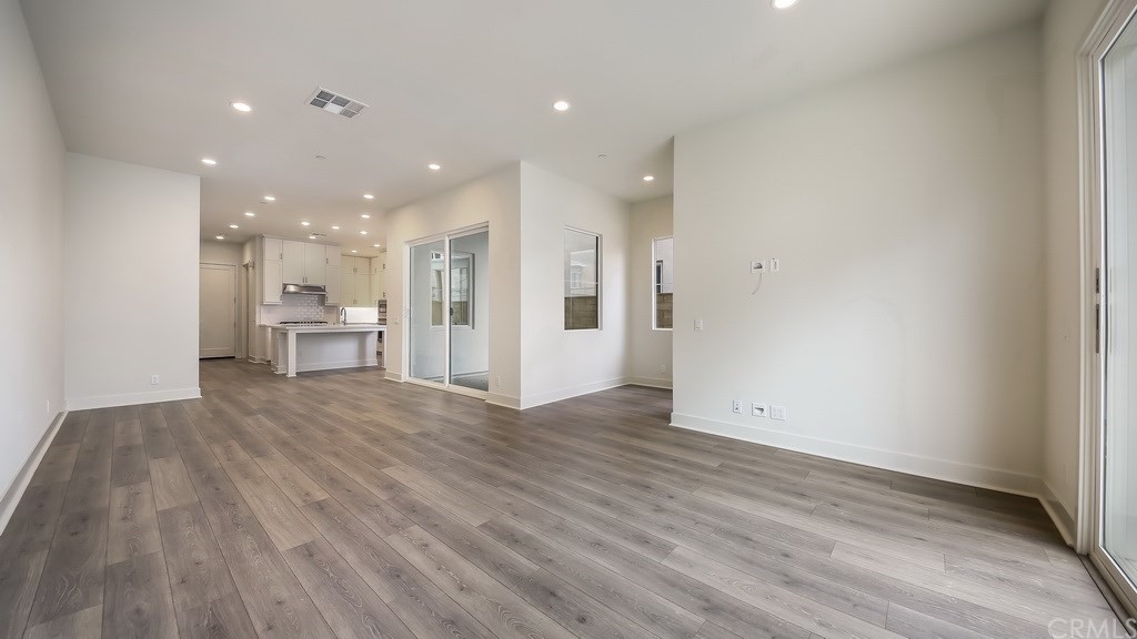 131 Novel Irvine, CA 92618 - Photo 3 of 15 a view of an empty room and wooden floor