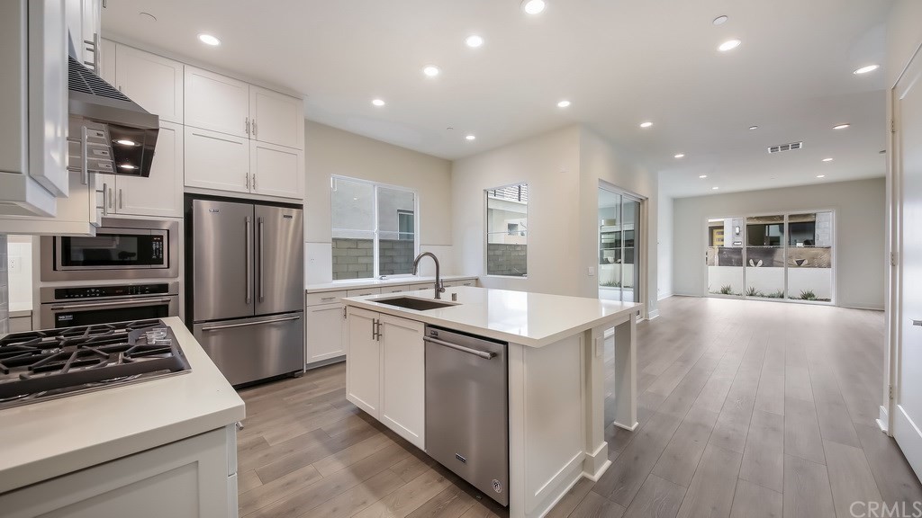 131 Novel Irvine, CA 92618 - Photo 6 of 15 a kitchen with a sink stainless steel appliances and cabinets