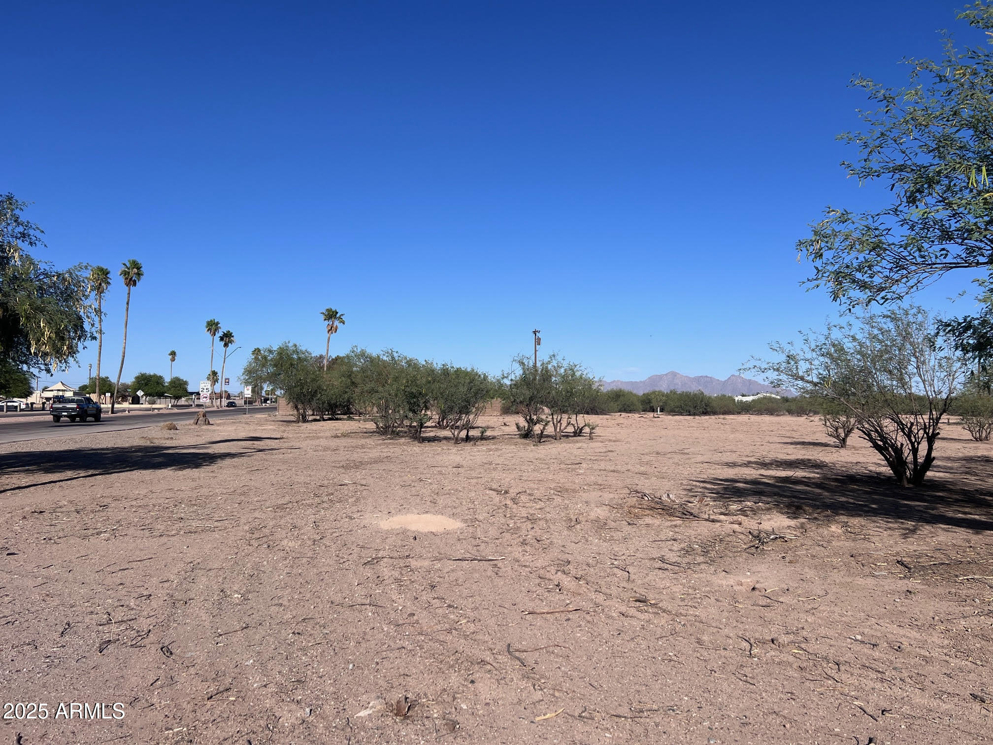 3865 West Shedd Road, Unit 1317 Eloy, AZ 85131 - Photo 3 of 9 a view of a road with a building in the background