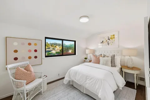 a bedroom with a bed and furniture